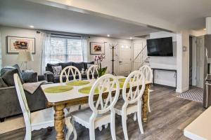 a dining room and living room with a table and chairs at Cozy Edgartown Vacation Rental Near Beach! in Edgartown