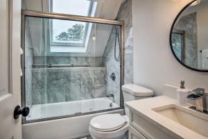 a bathroom with a shower and a toilet and a sink at Cozy Edgartown Vacation Rental Near Beach! in Edgartown +18 photos