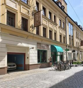a building with a bunch of bikes parked in front of it at Staycity Apartments Sukiennice 6 in Wrocław