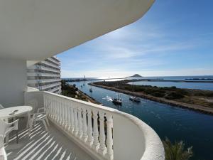 a balcony with a view of the water at La Manga Estacio in San Blas