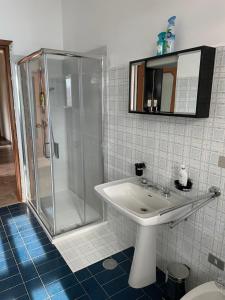 a bathroom with a shower and a sink at Casa Margherita in Pella +45 photos
