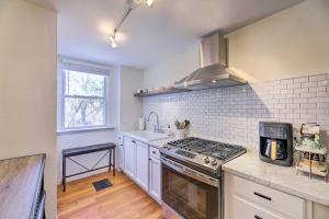 a kitchen with a stove top oven next to a sink at Cincinnati Vacation Rental 6 Mi to Downtown! in Cincinnati