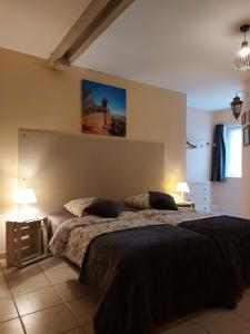 a bedroom with a large bed with two pillows at Mirabelle Bed & Breakfast in Ribeauvillé