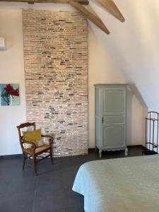 Ein Bett oder Betten in einem Zimmer der Unterkunft L'Ancien Couvent Cahuzac