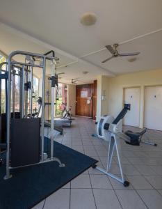 a gym with treadmills and machines in a room at Paradise Island Resort in Gold Coast