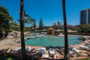 a large pool with chairs and a gazebo at Paradise Island Resort in Gold Coast +46 photos