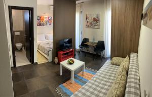 a living room with a couch and a bed and a table at Apartments Lov in Budva +99 photos