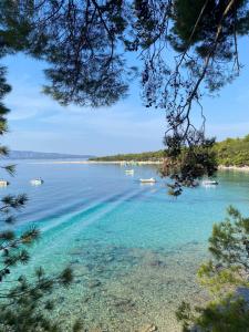a view of a body of water with boats in it at Villa de Blue-Rooftop pool & Jacuzzi in Bol