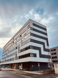 a building with a geometric design on the side of it at White Pearl Studio with parking in Holešovice in Prague