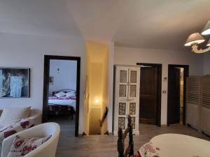 a living room with a couch and a bed in a room at Casa Vacanze in Morgex
