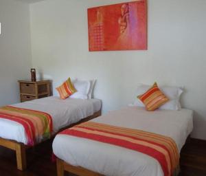 Postel nebo postele na pokoji v ubytování Yoma Cherry Lodge