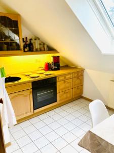 A kitchen or kitchenette at Ferienwohnung am Grumbach