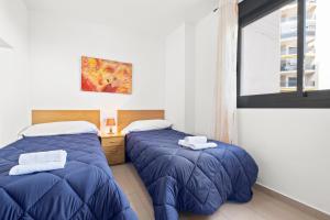 Posteľ alebo postele v izbe v ubytovaní Gemelos 24 Apartment 3-1-G Playa La Cala Beach