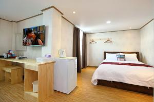 Postel nebo postele na pokoji v ubytování Traum Hotel & Condo + 22 fotografií