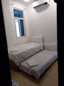 Voodi või voodid majutusasutuse GLC SUITES toas