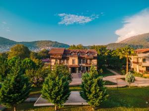 an aerial view of a large house with trees at Enso Inn in Fethiye