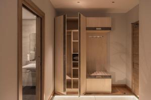 a cupboard in a room with a door open at Hotel NERU con Encanto in León