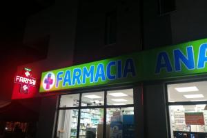 uma loja com uma placa na frente em A (cozy) place like HOME em Bucareste