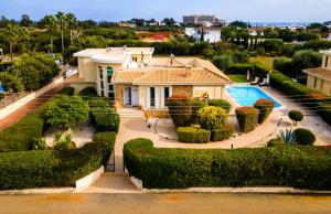 a house with a garden and a swimming pool at Cape Greco Villa Anastel 2 in Ayia Napa