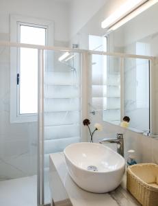 a white bathroom with a sink and a mirror at Cape Greco Villa Anastel 2 in Ayia Napa