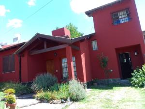 a red house with a red roof at Casa Bordó, B & B in Tandil