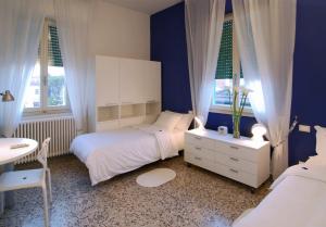 Postel nebo postele na pokoji v ubytování Il Piccolo Rooms