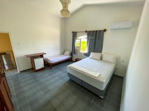 Posteľ alebo postele v izbe v ubytovaní Casa Beira-Mar em Guadalupe
