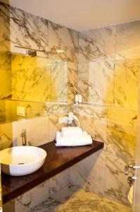 a bathroom with a sink and a mirror at Hotel Cami in Debar