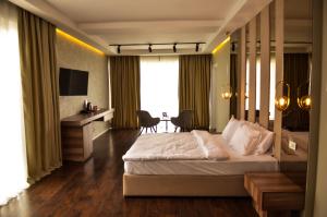 Hotel Cami客房内的一张或多张床位