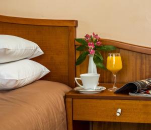 Postel nebo postele na pokoji v ubytování Lakonia Hotel