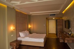Hotel Cami客房内的一张或多张床位