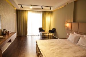 Hotel Cami客房内的一张或多张床位