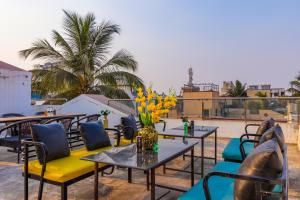 a person with their feet up on a table on a roof at Coliwo Deux - Chandan Nagar in Pune