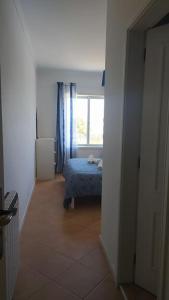 מיטה או מיטות בחדר ב-Apartamento em Torreira - Nenúfares