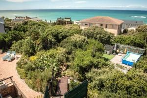 an aerial view of a house and the ocean at Paradise Self-Catering Units in Jeffreys Bay