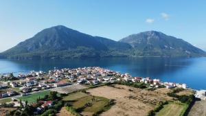 an aerial view of a town on the shore of a lake at Asteri Apartments Mytikas 2-Bedroom Seaview Courtyard in Mitika