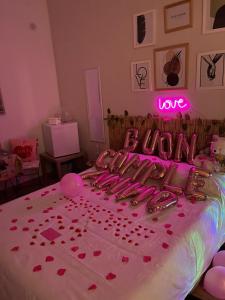 a room with a bed with hearts on it at I Gradini dell Eden in Naples