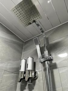a shower in a bathroom with a shower head at Apartment in St Denys in Southampton