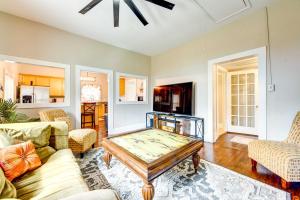 a living room with a glass table and chairs at Adorable Charlotte Vacation Rental in NoDa! in Charlotte