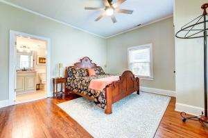 a bedroom with a bed and a ceiling fan at Adorable Charlotte Vacation Rental in NoDa! in Charlotte