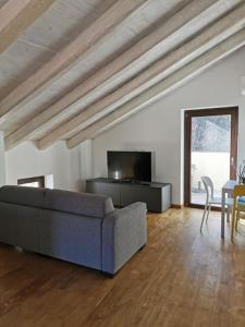 a living room with a couch and a table at Agriturismo Dai Marchesin in Nasino