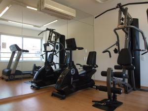 a gym with several tread machines in a room at Sol Ipanema Hotel in Rio de Janeiro