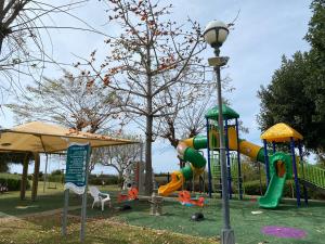 a park with a playground with a slide at פרינסס סוויט קיסריה in Caesarea