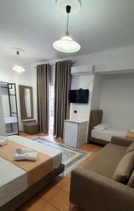 Postel nebo postele na pokoji v ubytování Hotel de Ksamil