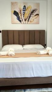 Postel nebo postele na pokoji v ubytování Hotel de Ksamil