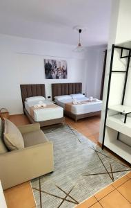 Postel nebo postele na pokoji v ubytování Hotel de Ksamil