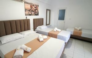 Postel nebo postele na pokoji v ubytování Hotel de Ksamil