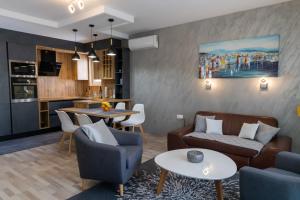 a living room with a couch and a table at Sunny Adriatic in Poreč