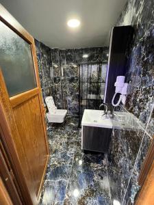 a bathroom with a sink and a toilet at Pequena Casa Apart in Istanbul +15 photos