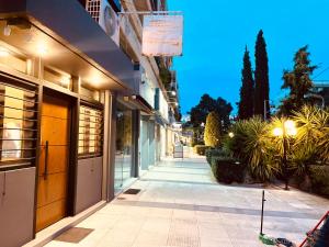 an empty sidewalk in front of a building at Loft Athens -Nomad Friendly # SuperHost hub# in Athens